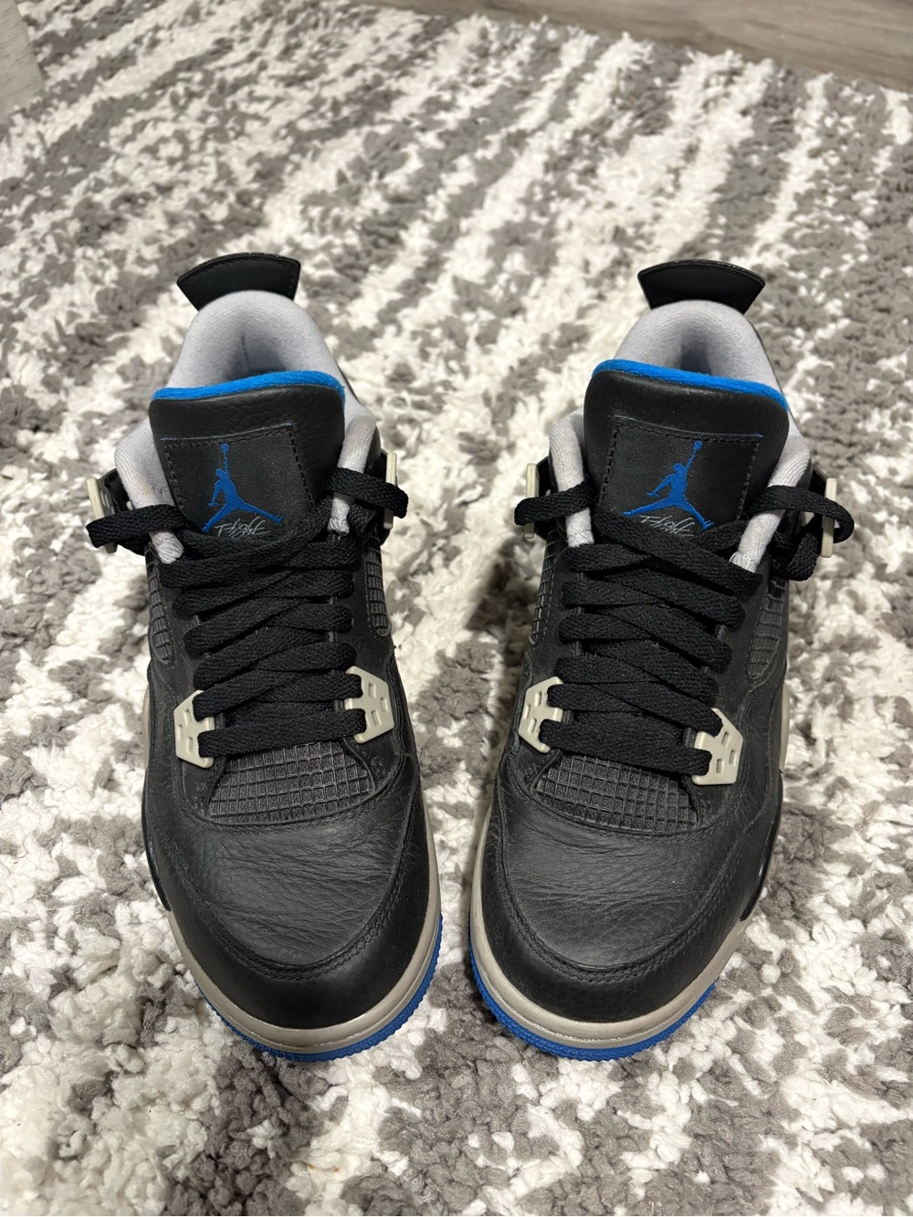 Nike Kids Black Sneakers with Blue Accents